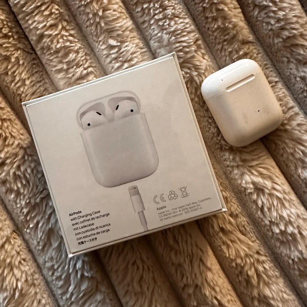 (1) brand new AirPods (1) second hand AirPods total of 2